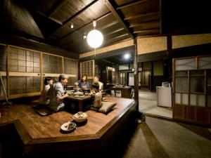 a group of people sitting in a large room at Takinomoto Kondo family - Vacation STAY 30830v in Toon