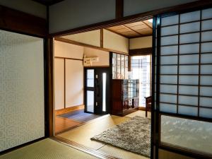 a room with a hallway with a door and a window at MIU HOUSE - Vacation STAY 30561v in Izumo