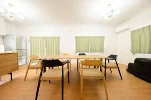 a dining room with a table and chairs at Lights YADO Akasaki - Vacation STAY 15901 in Sasebo