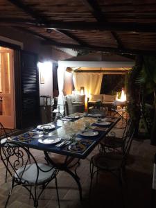 a table and chairs in a room with a couch at Beach villa La Genziana in Parghelia +52 photos