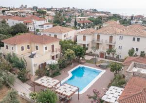 an aerial view of a house with a swimming pool at Erietta Studios & Apartments by Kika Residences in Stoupa