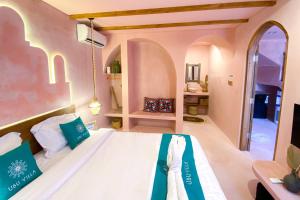 a bedroom with a bed in a room at Ubu Villa Marrakech - near Yogyakarta City Center in Jetis