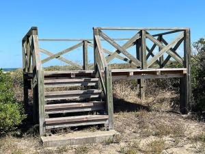 a wooden gate in the middle of a field at Hasaki Seaside Campsite - Vacation STAY 51113v in Shari