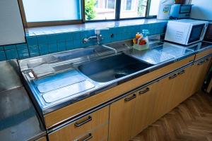 a kitchen with a sink and a counter top at Hanareya Hyō - Vacation STAY 49547v in Nakatsugawa +10 photos
