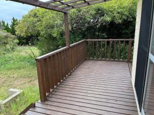 a wooden deck with a pergola on a house at Hasaki Seaside Campsite - Vacation STAY 51117v in Shari