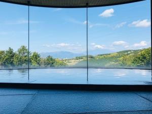 a room with a large window with a view at Kannami Springs Hotel Kannami Glamping - Camp - Vacation STAY 62739v in Mishima