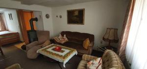 a living room with a couch and a coffee table at Ferienwohnungen Kempe - Hauptstraße in Bad Lauterberg
