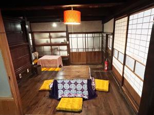 an empty room with yellow mats on the floor at Nano Village Okayama - Vacation STAY 66531v in Kaga