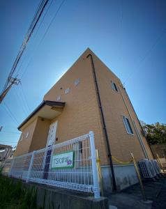a building with a fence in front of it at TSK Nanjyo - Vacation STAY 70147v in Sashiki