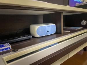 a tv sitting on top of a shelf at TSK Nanjyo - Vacation STAY 70147v in Sashiki