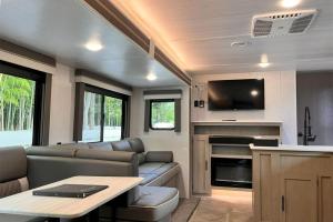 an rv living room with a couch and a tv at LUCY RESORT - Vacation STAY 77592v in Kamigō