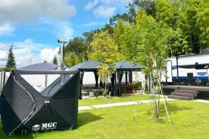 a gazebo in a park with a building at LUCY RESORT - Vacation STAY 77592v in Kamigō +4 photos