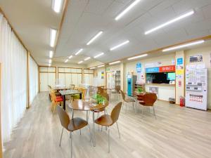 a waiting room with tables and chairs in a store at Succeeding Gorge Onsen Hall - Vacation STAY 74512v in Inuma