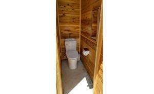 a bathroom with a toilet in a wooden wall at Ashigarakami-gun - Camp - Vacation STAY 84740v in Hokizawa