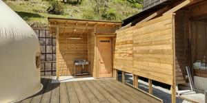a wooden building with a deck with a grill at Ashigarakami-gun - Camp - Vacation STAY 84740v in Hokizawa +6 photos