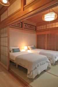 a room with two beds in a room at Utage HANARE - Vacation STAY 93680v in Kainan
