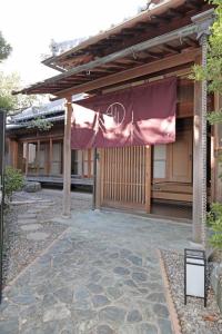 a building with a flag on the side of it at Utage HANARE - Vacation STAY 93680v in Kainan