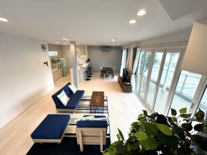 a living room with a couch and chairs and a table at Karatsu seaside house - Vacation STAY 94789v in Karatsu