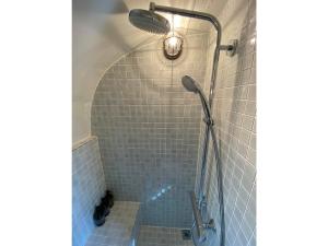 a shower with a shower head in a bathroom at ANKR VILLAGE KUJUKURI PRIVATE CAMP - Vacation STAY 93638v in Sammu +14 photos