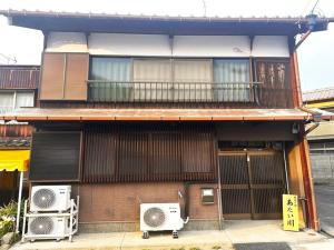 a building with two air conditioners on the side of it at Tanabe no Yado Ataigawa - Vacation STAY 10883v in Tanabe