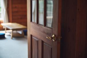 a wooden door with a handle in a room at Viila Wan Hamana - Vacation STAY 16610 in Kosai
