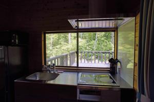 a kitchen with a sink and a window with a deck at HARUNA VILLA - Vacation STAY 27961v in Kita-karuizawa +38 photos