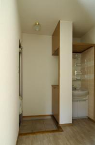 a bathroom with a sink and a toilet in a room at Minpaku =SAKURA= - Vacation STAY 16462 in Osaka