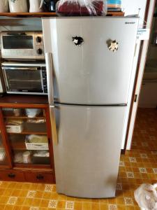 a refrigerator in a kitchen with two eyes on it at Ishinomaki - House - Vacation STAY 16456 in Ishinomaki