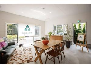 a living room with a table and a couch at MORIHAKU - Vacation STAY 34533v in Kutsukake