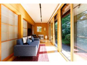 a living room with a couch and a table at MORIHAKU - Vacation STAY 34604v in Kutsukake +13 photos