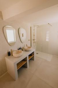 a bathroom with two sinks and a shower at Casa Xuixo in Tenerife South in Guía de Isora +37 photos