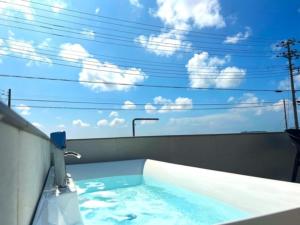a jacuzzi tub with the sky in the background at OCEAN FRONT TATEYAMA - Vacation STAY 66632v in Tateyama
