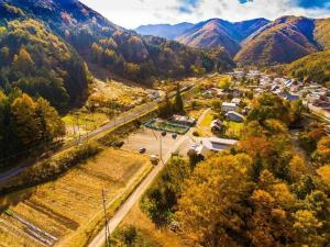 una vista aerea di una città in montagna di Miyori Hometown Experience Village Campsite (Nakam - Vacation STAY 34963v a Nikko Altre 4 foto