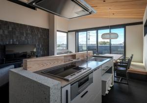 a kitchen with a sink and a stove top oven at Kujukuri point 59 - Vacation STAY 49312v in Kujukuri
