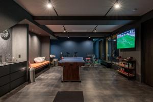 a room with a pool table and a tv at Kujukuri point 59 - Vacation STAY 49312v in Kujukuri