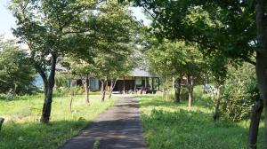 a path in front of a house with trees at Kazeoka Sakuma - Vacation STAY 63930v in Iiyama