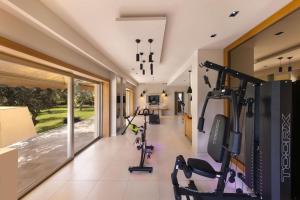a gym with a row of exercise bikes in a room at Villantonella in Sorrento