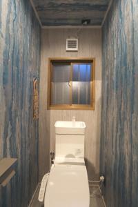 a bathroom with a toilet and a window in it at Kaira no Teitaku - Vacation STAY 63757v in Iwase