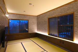 an empty room with two windows and lights at Kaira no Teitaku - Vacation STAY 63757v in Iwase