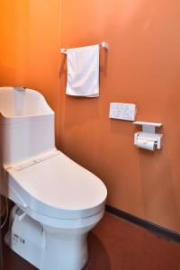 a bathroom with a toilet and two rolls of toilet paper at Sapporo - House - Vacation STAY 16825 in Sapporo +28 photos