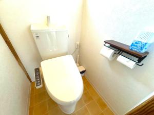 a bathroom with a white toilet and some toilet paper at ANGO KUJUKURI 3 - Vacation STAY 17094 in Kujukuri +41 photos