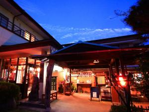 a building with a blue awning in front of it at Airy Peak - Vacation STAY 82764v in Takaharu