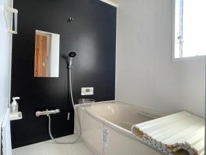 a bathroom with a bath tub and a sink at Agrito Island Time - Vacation STAY 84454v in Imabari +12 photos