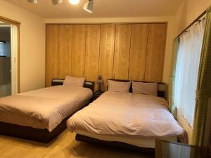 Giường trong phòng chung tại Platinum Yasaka - Vacation STAY 84649v