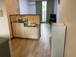 a kitchen with a sink and a counter at Chambord Kyomachi 102,103,201,202,205,207 - Vacation STAY 85966v in Kumamoto +1 photo