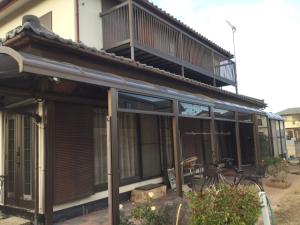 a house with a balcony on top of it at Strawberry Villa - Vacation STAY 17858 in Ichihara