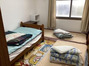 a room with two bunk beds and a window at Strawberry Villa - Vacation STAY 17858 in Ichihara