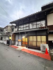 a building with an orange cone in front of it at Karin Housu - Vacation STAY 82851v in Takayama