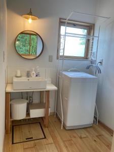 a bathroom with a sink and a mirror at halcoya hanare - Vacation STAY 89587v in Shizukuishi