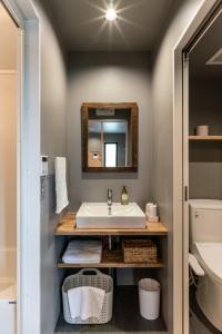 a bathroom with a sink and a mirror at Coteji Do - Vacation STAY 78358v in Ishigaki Island